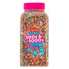 Jar of colorful 100s and 1000s sprinkles with a pink lid on a white background
