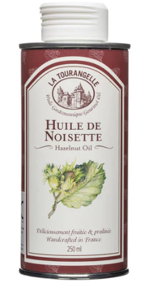 Can of Huile de Noisette (Hazelnut Oil) with a white lid on a white background