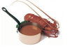 Copper pot with a ladle on a white background